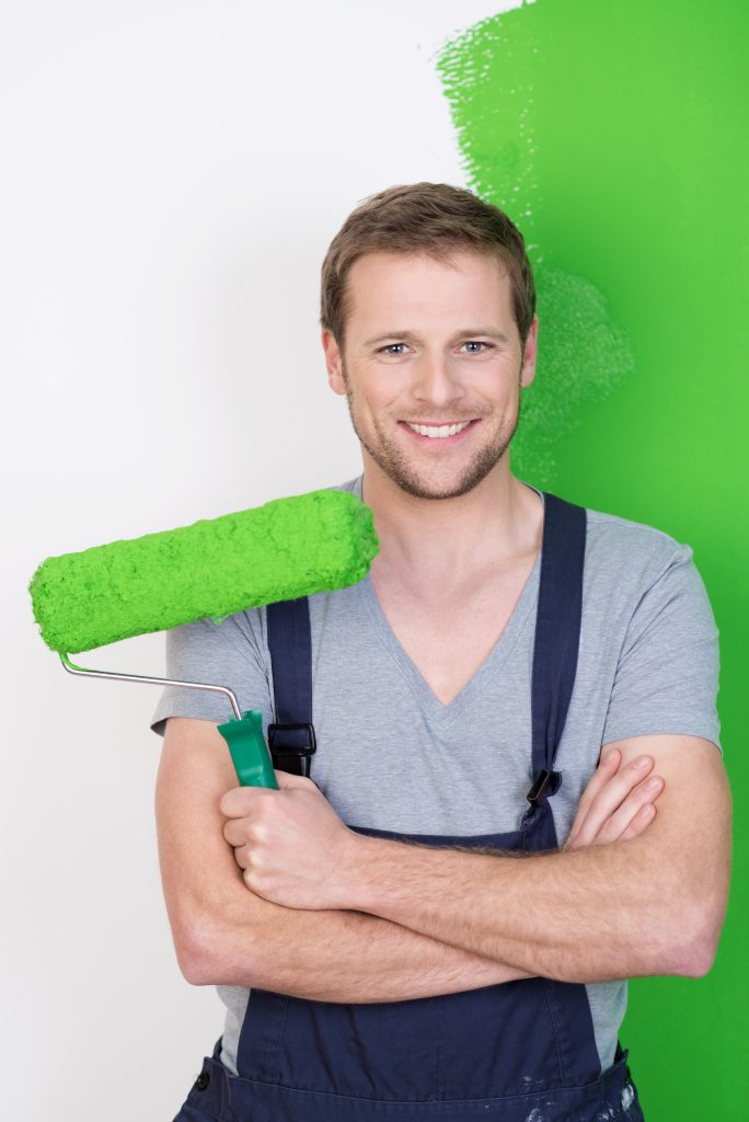 painter-holding-brush-preparing-for-home-wall-painting-service-while-smiling.jpg painter holding brush preparing for home wall painting service while smiling